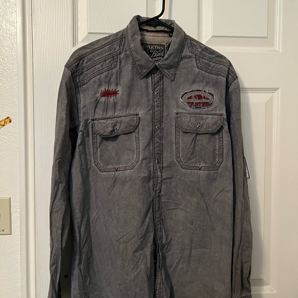 My husband wore this shirt 10-15 times, it is in good condition